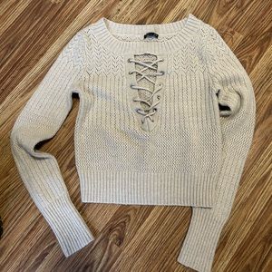 Cream colored express lace up sweater. Soft excellent use condition,extra small.